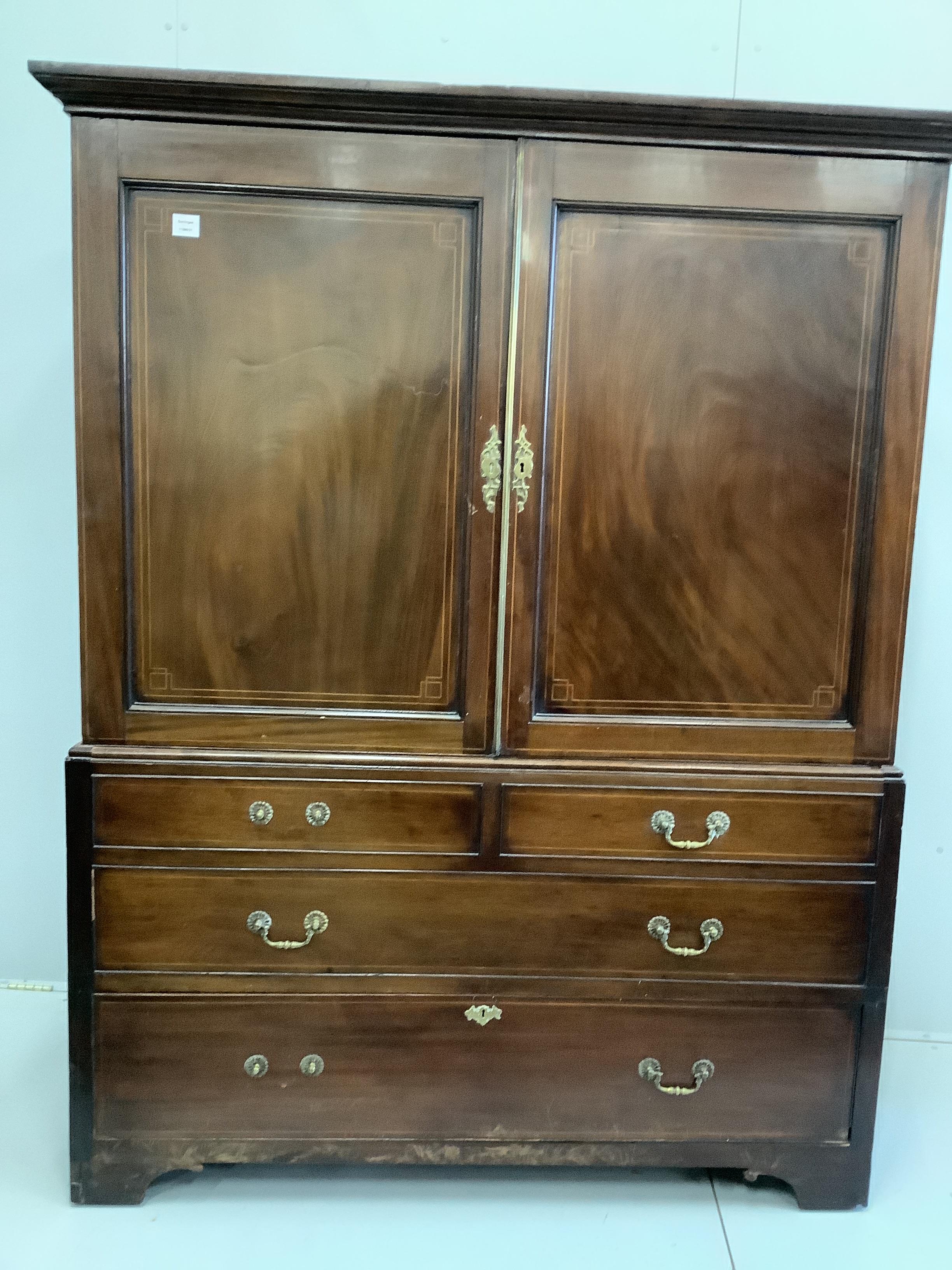 A George III mahogany linen press, converted to a hanging wardrobe, width 146cm, depth 64cm, height 186cm